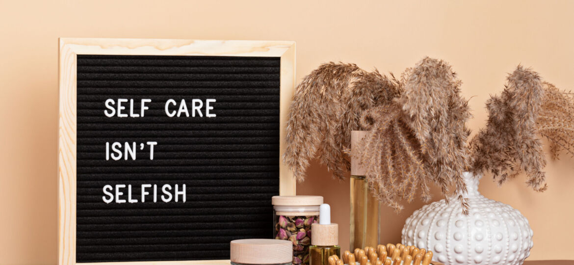Self care is not selfish. Felt letter board with body and mind care products. Love yourself, physical and mental health idea