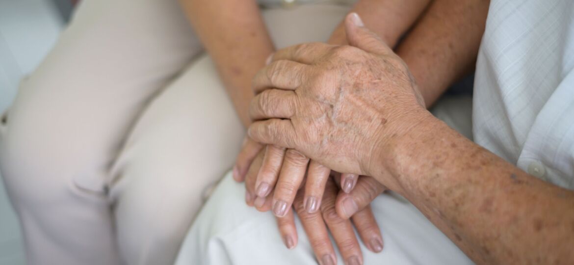 Close up of elderly hands holding each other , Grandfather hands is holding grandma hands , together , family concept