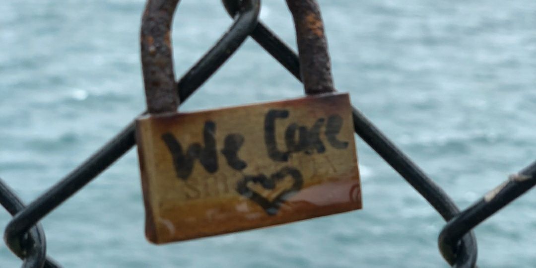 we-care-love-written-on-a-lock_t20_E4G8R1