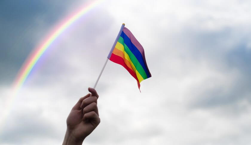 young-holding-a-lgbt-flag-background-big-bisexual-blue-bright-celebrating-civil-closeup-colorful_t20_jLyznp-840x487