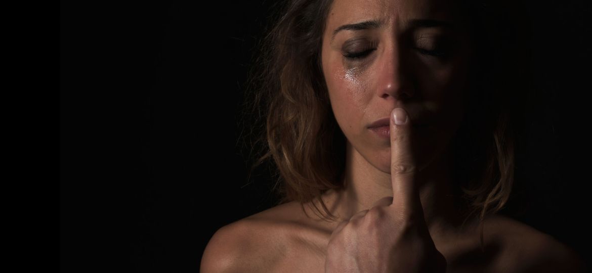 Concept of woman scared to speak out about abuse and domestic violence.