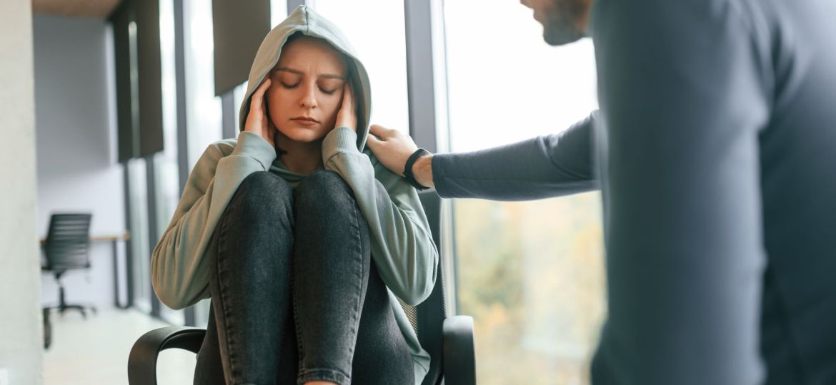 Depressed woman is at an appointment with a psychologist